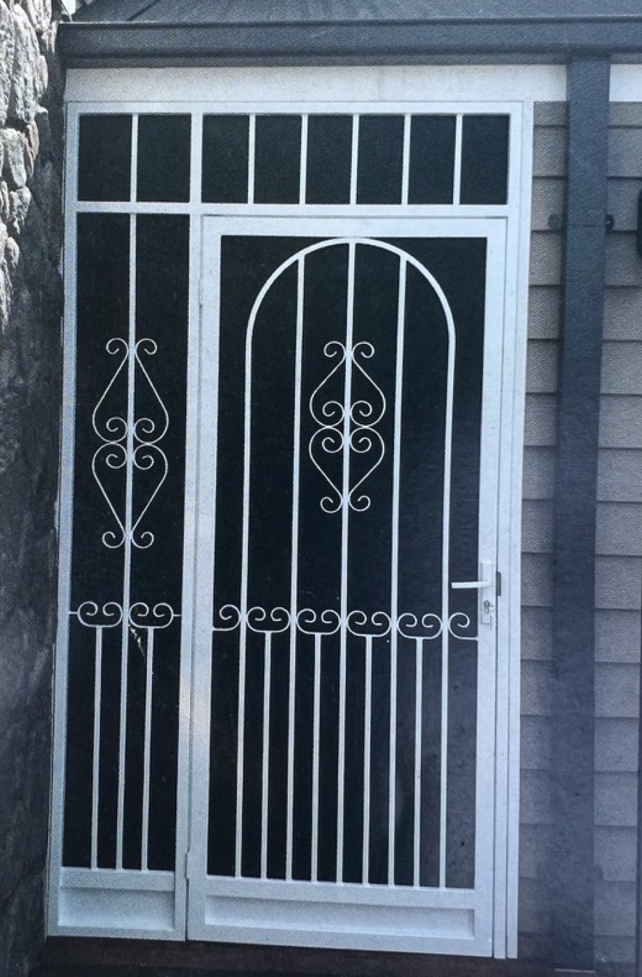 White arched decorative security door with matching side panel