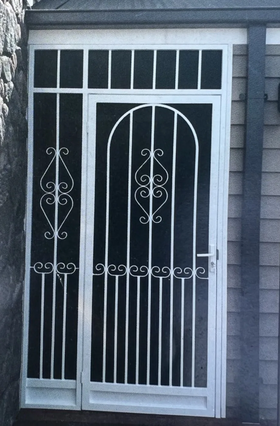 White arched decorative security door with matching side panel