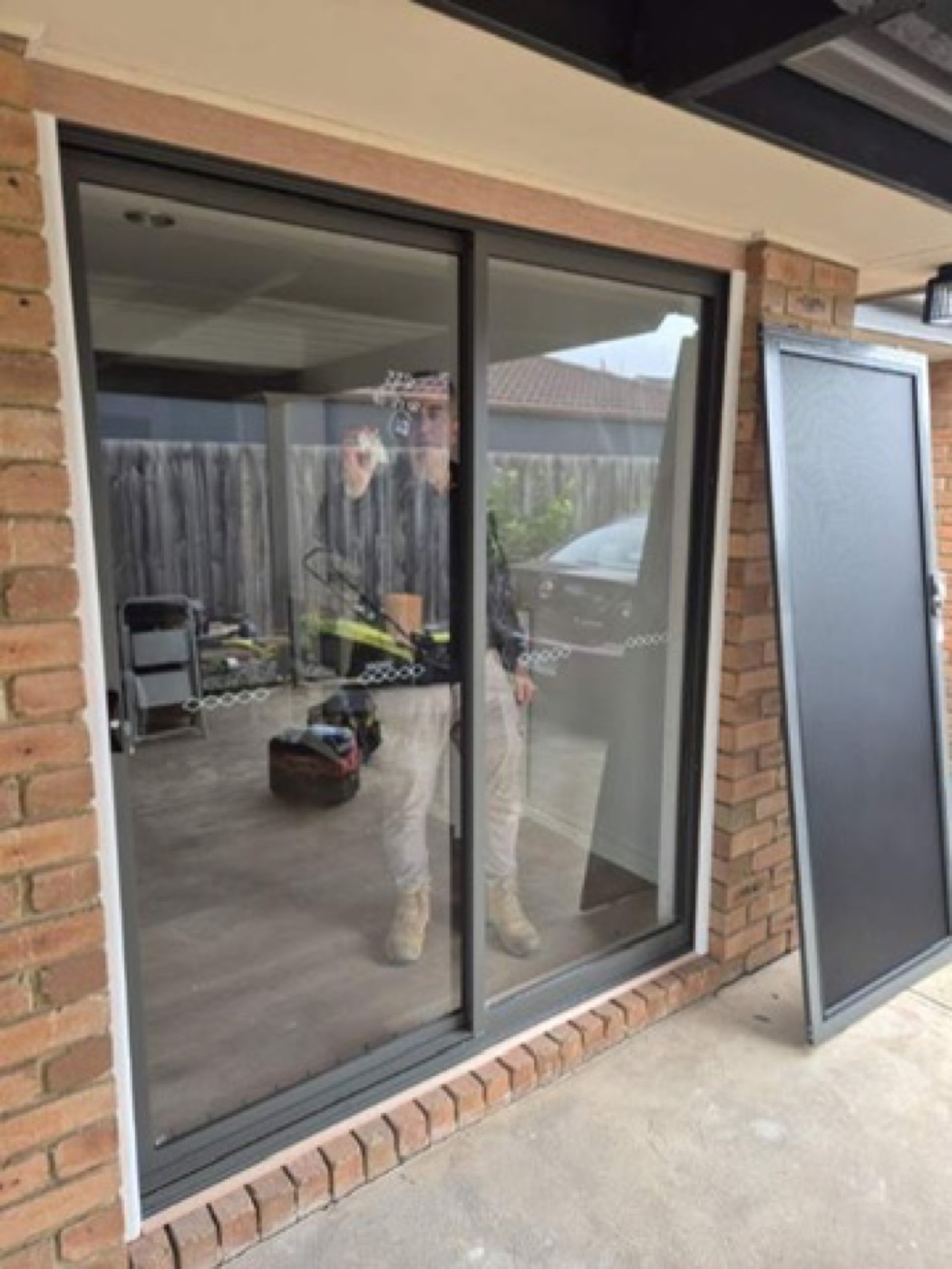 New aluminium sliding door installed with security screen ready to fit