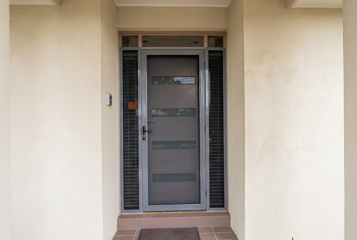 Modern security screen door with mesh feature windows and matching security side panels